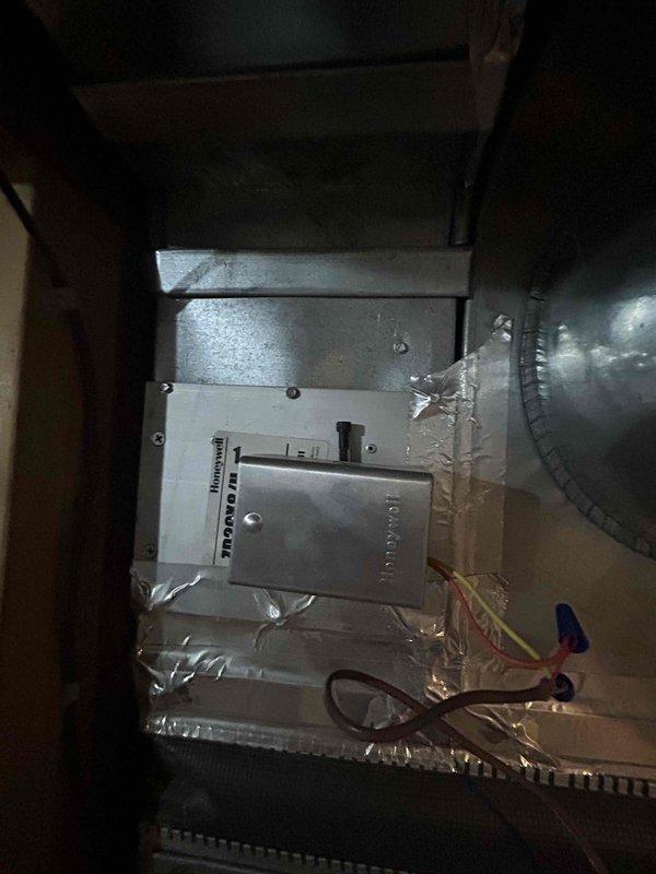Responded to no cooling complaint for upstairs zone. Upon arrival, accessed attic-mounted air handler with Honeywell controls and inspected system components, ductwork connections, and electrical wiring. Performed diagnostic evaluation of equipment operation and documented existing installation conditions with photographic evidence for service records.