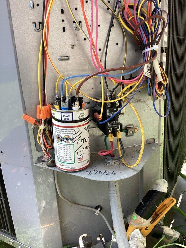Responded to no cooling complaint on residential air conditioning system. Upon inspection, diagnosed failed dual-run capacitor preventing compressor and condenser fan motor operation. Replaced defective capacitor with new 35/5 μF unit, verified proper electrical connections, and tested system for normal operation. Unit restored to full cooling capacity with all components functioning within manufacturer specifications.