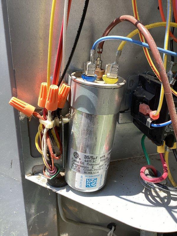 Responded to no cooling complaint on residential air conditioning system. Upon inspection, diagnosed failed dual-run capacitor preventing compressor and condenser fan motor operation. Replaced defective capacitor with new 35/5 μF unit, verified proper electrical connections, and tested system for normal operation. Unit restored to full cooling capacity with all components functioning within manufacturer specifications.