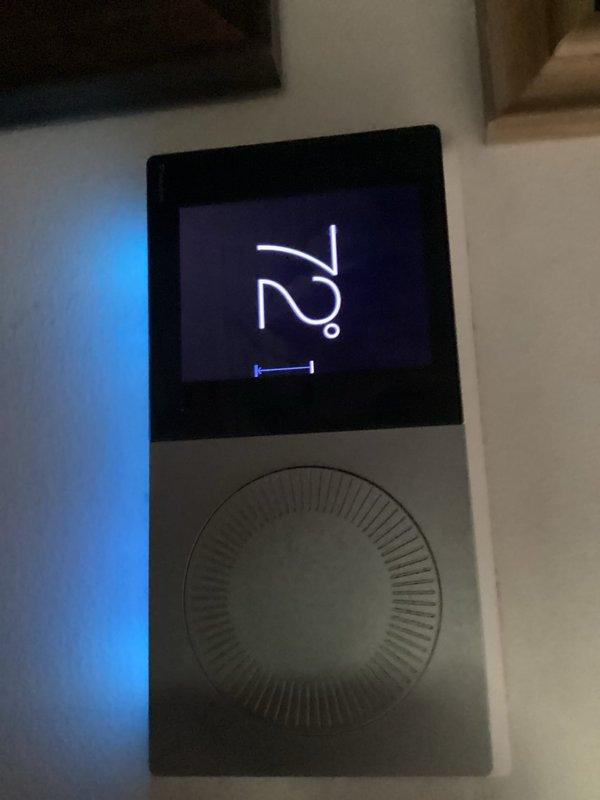 Responded to service call for air conditioning system failing to maintain setpoint temperature. Upon arrival, found Daikin thermostat displaying 73-74°F while set to 54°F, indicating significant temperature differential and inability to reach desired cooling setpoint. Inspected thermostat operation and verified display functionality showing "main room" zone with adjusted settings active. System evaluated for proper communication between thermostat and cooling equipment to address temperature control issue.