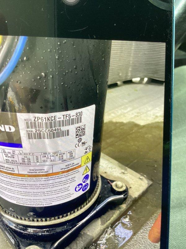 Performed refrigerant recovery, leak seal application, and system service on HVAC unit with ZP61KCE-TF5-830 compressor. Recovered refrigerant from system, applied leak sealant to address refrigerant loss, and cleaned accumulated oil and debris from compressor base and unit housing. System inspected, refrigerant lines and electrical connections verified secure, and unit returned to operational status.