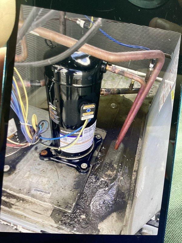 Performed refrigerant recovery, leak seal application, and system service on HVAC unit with ZP61KCE-TF5-830 compressor. Recovered refrigerant from system, applied leak sealant to address refrigerant loss, and cleaned accumulated oil and debris from compressor base and unit housing. System inspected, refrigerant lines and electrical connections verified secure, and unit returned to operational status.