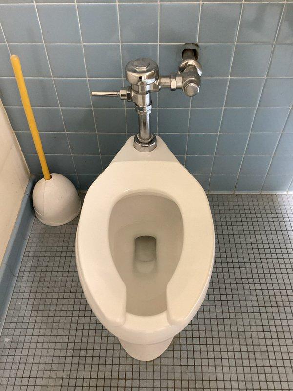 Responded to service call for multiple plumbing issues including a malfunctioning toilet flapper in TF 149 bathroom causing repeated flushing cycles and potential water waste, dripping water in upstairs bathroom, and hard water buildup in kitchen sinks requiring evaluation. Inspected toilet flush valve assembly and flapper mechanism, replaced defective flapper components to eliminate continuous running water condition. Documented existing conditions with photographs showing toilet installation with chrome flush valve system and wall-mounted configuration on tiled surfaces.