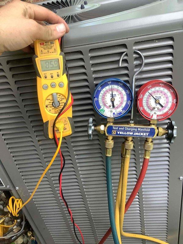 Responded to callback for A/C system unable to maintain setpoint, with thermostat set to 69°F but temperature rising to 71°F. Performed diagnostic testing using digital multimeter and refrigerant manifold gauges to assess system performance and refrigerant pressures. Customer reported identical cooling issues occurred previously in late May, indicating recurring capacity problem requiring further evaluation of compressor performance, refrigerant charge, and potential airflow restrictions.
