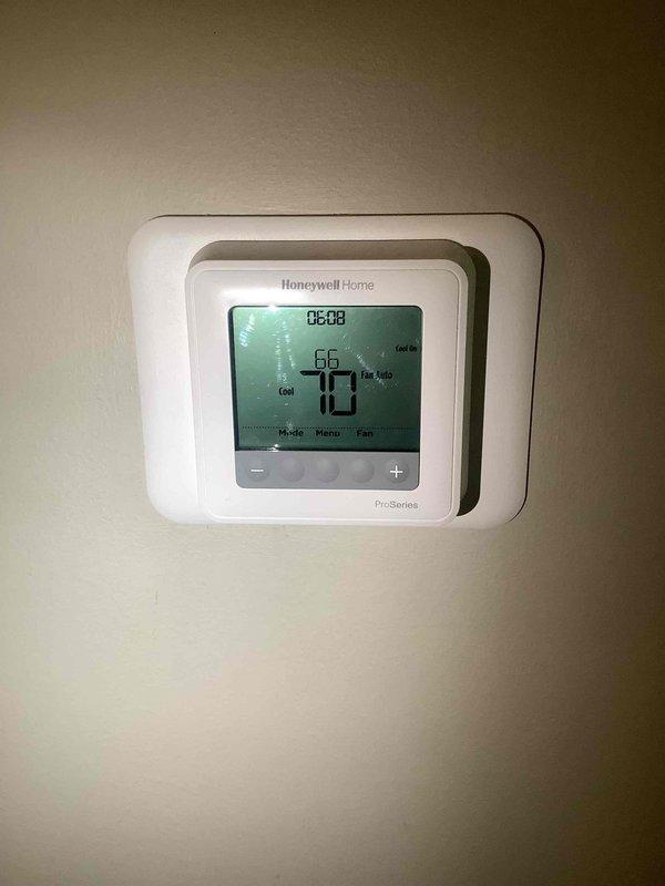 Responded to callback for A/C system unable to maintain setpoint, with thermostat set to 69°F but temperature rising to 71°F. Performed diagnostic testing using digital multimeter and refrigerant manifold gauges to assess system performance and refrigerant pressures. Customer reported identical cooling issues occurred previously in late May, indicating recurring capacity problem requiring further evaluation of compressor performance, refrigerant charge, and potential airflow restrictions.