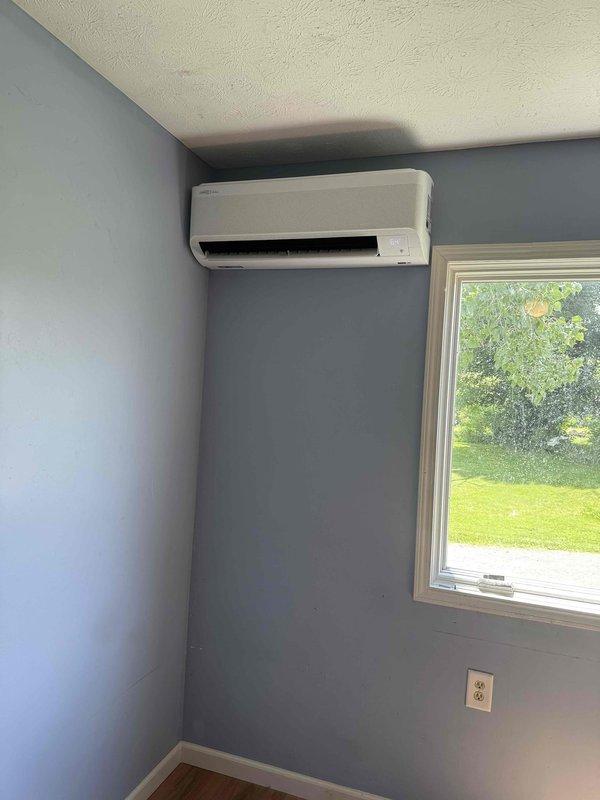 Completed installation of Lennox two-head ductless mini-split system. Mounted indoor air handler units in two separate rooms with proper wall placement and secure mounting near ceiling level. Installed refrigerant line sets, condensate drainage, and electrical connections between indoor units and outdoor condenser to ensure proper system operation and climate control for the residence.