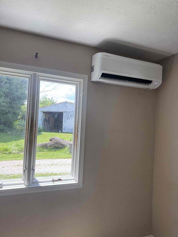 Completed installation of Lennox two-head ductless mini-split system. Mounted indoor air handler units in two separate rooms with proper wall placement and secure mounting near ceiling level. Installed refrigerant line sets, condensate drainage, and electrical connections between indoor units and outdoor condenser to ensure proper system operation and climate control for the residence.