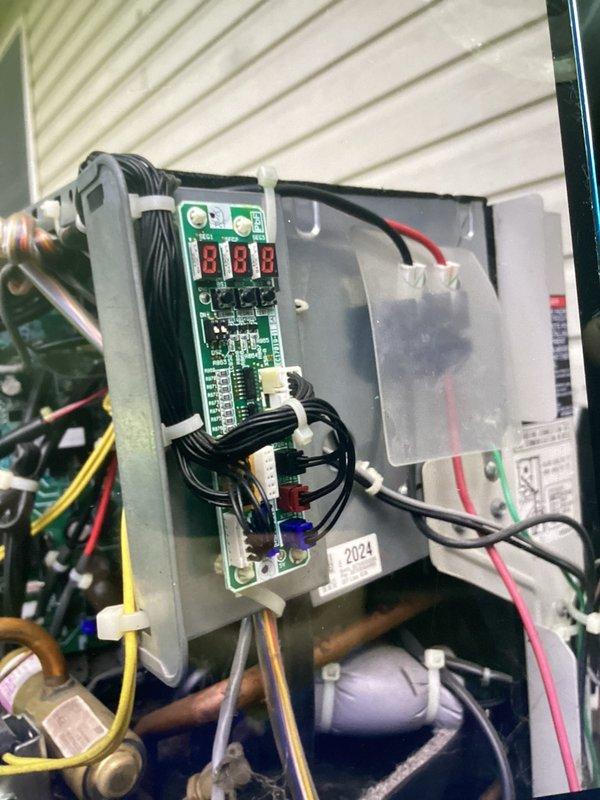 Returned to site and installed replacement control board in HVAC unit. Connected all wiring harnesses to new circuit board, verified proper electrical connections at terminal blocks, and confirmed LED display readings were operational. System tested and returned to normal operation.
