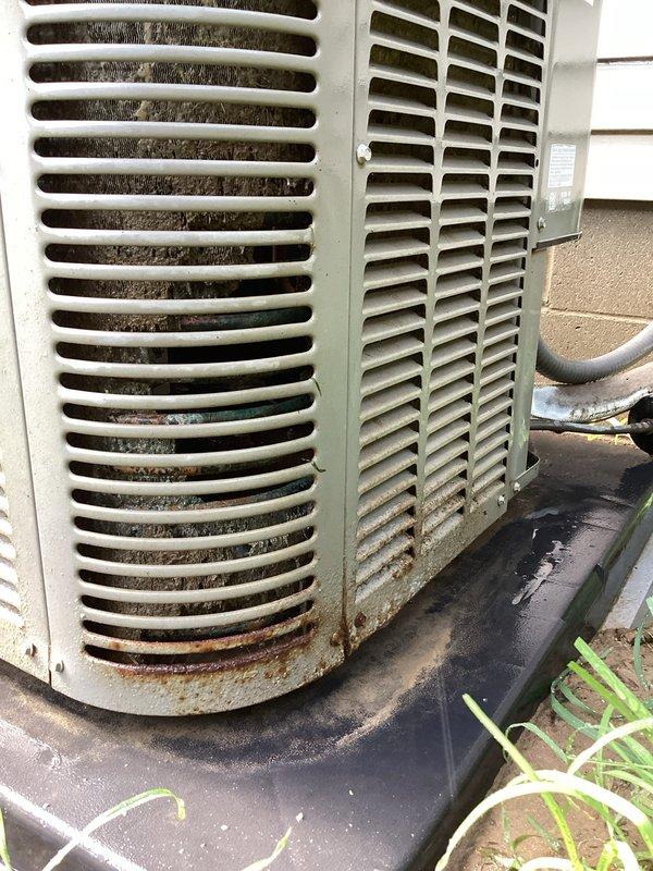 Completed basic monthly cooling maintenance on residential air conditioning system. Performed standard CCC protocol inspection of outdoor condensing unit, which showed signs of age with visible rust staining on lower cylindrical section and debris accumulation in louver vents. Installed 16x25x1 filter as part of routine maintenance service. System operational upon completion.