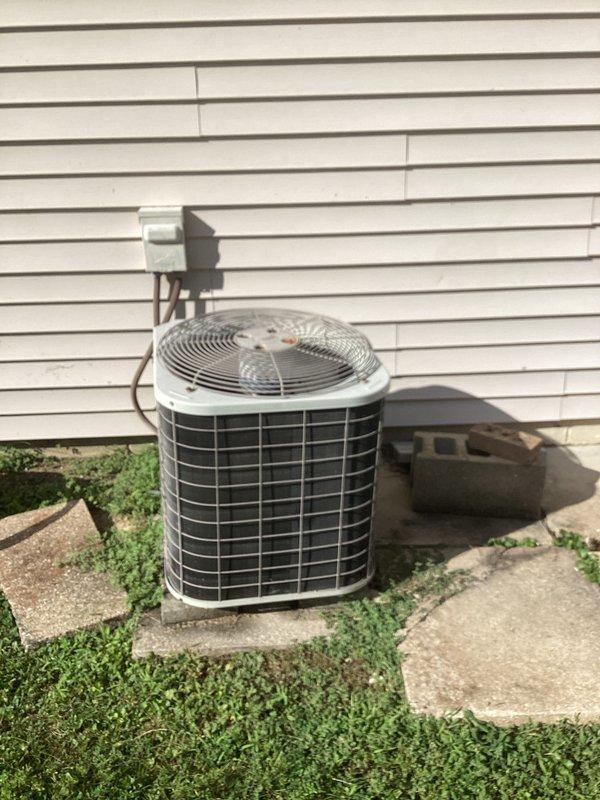 Performed routine cooling maintenance on residential Bryant HVAC system. Inspected outdoor condensing unit with cylindrical configuration, verified thermostat operation displaying 77°F, and documented filter status per customer's monthly maintenance agreement. All equipment operating within normal parameters.