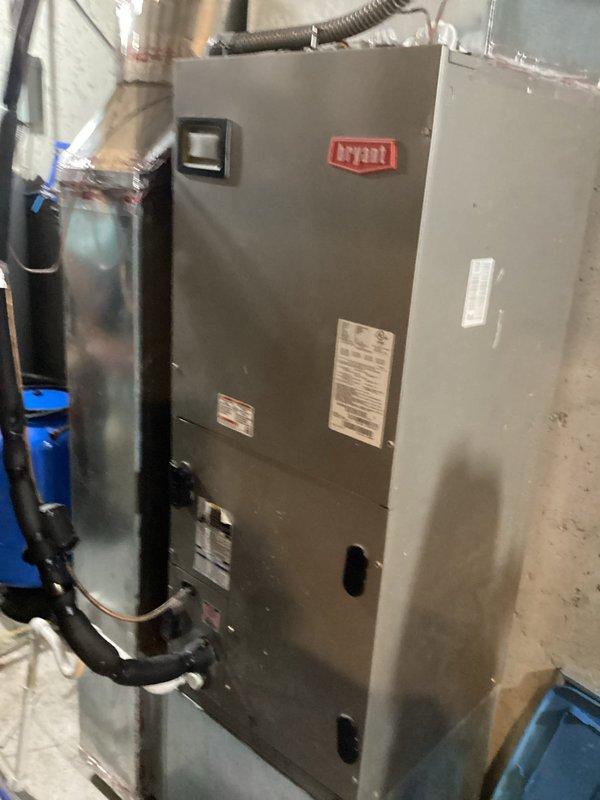 # HVAC Service Call - No Cooling Issue

Responded to a no cooling complaint on a Bryant system over 10 years old. Upon arrival, found outdoor condenser unit positioned against brick wall with vegetation growth around base restricting airflow. Inspected indoor air handler in basement utility room and outdoor condensing unit. 

Performed diagnostic testing on both indoor and outdoor components to identify cooling failure. Cleared vegetation and debris from around condenser base to restore proper airflow clearance. Evaluated refrigerant pressures, electrical connections, and compressor operation. Checked capacitor values, contactor condition, and verified proper voltage supply to outdoor unit.

Inspected indoor air handler for proper airflow, clean evaporator coil, and correct blower operation. System restored to operational status with cooling functionality confirmed before departure.