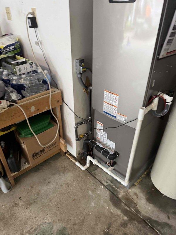Completed full HVAC system installation consisting of Lennox brand air conditioning condenser unit and gas furnace. Outdoor condenser positioned on concrete pad with refrigerant lines connected and routed to building, indoor air handler installed in utility area with proper electrical connections and ductwork integration. System fully commissioned, tested for proper operation, and left in working condition with all refrigerant lines, condensate drainage, gas connections, and electrical wiring installed per manufacturer specifications.