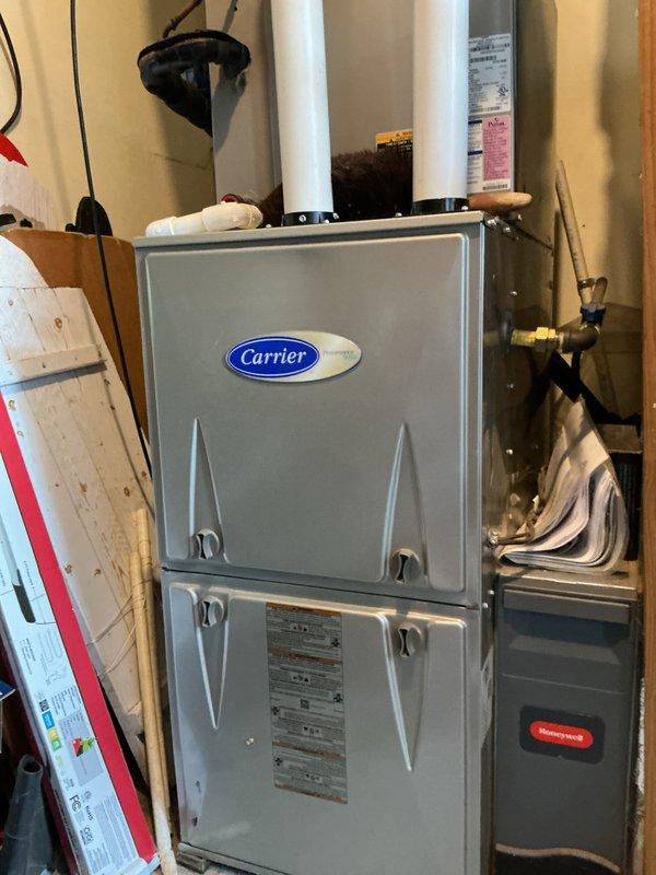 Completed basic monthly cooling maintenance visit on Carrier HVAC system. Performed standard inspection of furnace unit, verified proper operation of thermostat displaying 74°F indoor temperature with temporary hold setting, and checked associated components including PVC venting, refrigerant lines, and electrical connections. All equipment found operating within normal parameters with no issues identified during this routine preventative maintenance service.