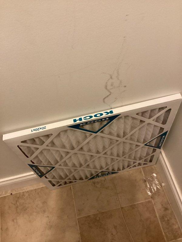 Completed basic monthly cooling maintenance visit. Replaced 20x20x1 pleated air filter with new KOCH brand filter as part of recurring service agreement. Observed heavy dust accumulation on circular air vent register requiring future cleaning attention to maintain optimal airflow and system efficiency.