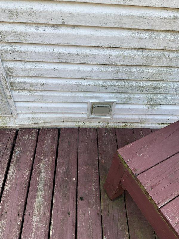 Conducted comprehensive evaluation of existing HVAC system in modular home experiencing refrigerant leak affecting both heating and cooling performance. System was determined to be non-functional due to significant refrigerant loss and unable to maintain proper temperature control. Inspected air handler unit located in interior utility closet and assessed exterior condensing unit positioned adjacent to home's deck area. Documented current equipment condition through photographic records showing weathered exterior siding, deck-mounted outdoor unit location, and interior air handler installation with existing PVC condensate drainage system. Provided detailed replacement estimate for complete HVAC system installation to meet program requirements for financial assistance application, ensuring proposed equipment and installation costs remain within specified budget parameters. Prepared documentation as one of three required competitive estimates for loan application submission.