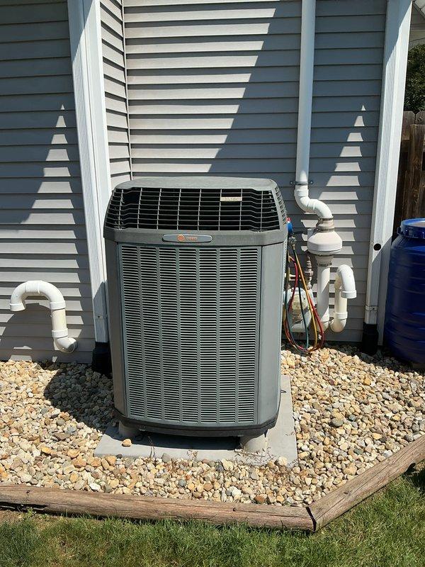 Completed basic monthly cooling maintenance visit on residential air conditioning system. Performed standard inspection of outdoor condensing unit, which is a 2009 R-410A system with design pressure of 480 PSI. Visual inspection confirmed unit is operating properly with no visible refrigerant leaks, proper drainage, and adequate airflow through condenser coils. Noted that 20x25x4 filter was not included in this service visit per service agreement terms.