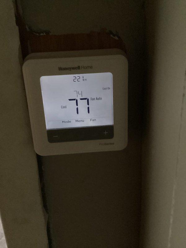 Completed routine maintenance on Goodman air conditioning system and heating equipment. Performed comprehensive AC tune-up including inspection of outdoor condensing unit, verified refrigerant line insulation integrity, and checked electrical disconnect components. Tested Honeywell programmable thermostat operation, confirmed cooling mode functioning properly at 74 degrees with fan set to auto mode. System operating within normal parameters with no issues identified during inspection.