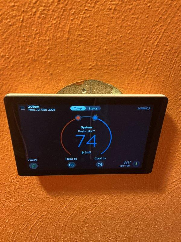 Completed comprehensive cooling system maintenance on Lennox air conditioning unit. Performed standard preventative maintenance procedures including inspection of condenser unit, verification of thermostat operation and programming, and replacement of 20x20x4 air filter as included in service agreement. System operational with thermostat displaying proper temperature readings and cooling mode functioning correctly at setpoint of 74°F.