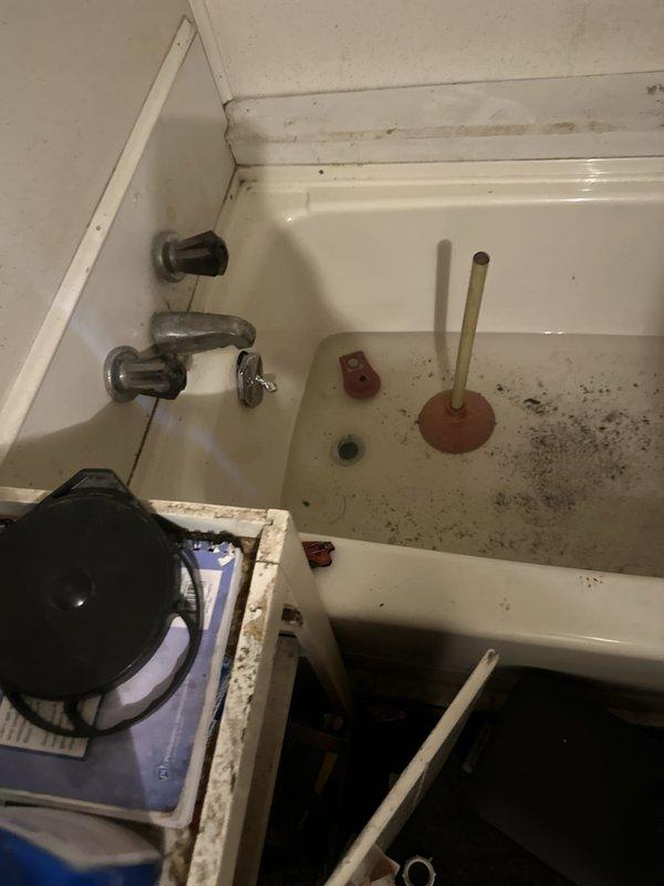 Responded to clogged drain line affecting utility sink and bathtub. Successfully cleared blockage in shared drainage line between fixtures using mechanical augering equipment. Restored proper drainage flow to both sink and tub, with all wastewater now evacuating normally through the system.