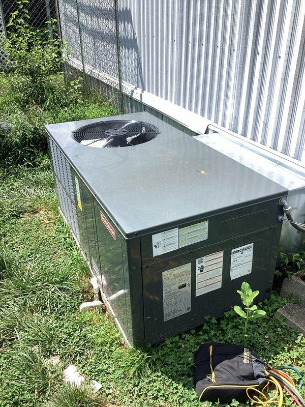 Responded to service call for 1-year-old Goodman AC unit experiencing frequent freezing with inadequate cooling performance (indoor temperature reaching 90°F with thermostat set to 75°F). Upon arrival, connected manifold gauge set to outdoor condensing unit to diagnose system pressures and refrigerant charge. Inspected evaporator coil access point in crawl space beneath structure to assess airflow restrictions and coil condition. Customer reported unit had been previously cleaned and air filters changed weekly due to multiple pets in home, ruling out basic maintenance issues as primary cause of freezing condition.