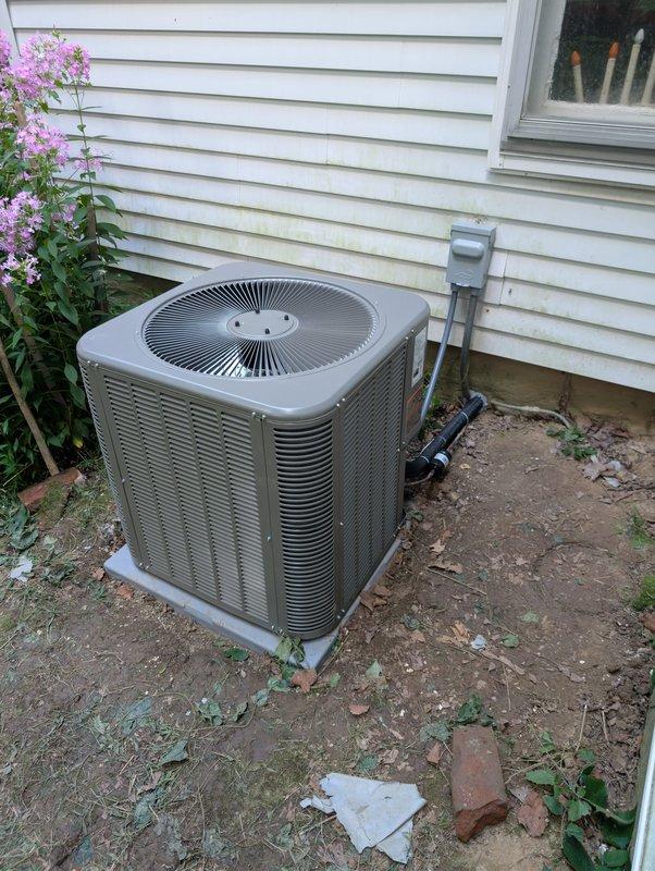 Completed full HVAC system installation at residential property, including outdoor condenser unit and indoor Lennox air handler/furnace system. Exterior condenser was positioned on concrete pad adjacent to home with proper electrical disconnect and conduit installation, while the indoor Lennox equipment was installed in basement mechanical area with copper refrigerant lines, insulated tubing, and all necessary connections properly secured to concrete block walls. System was fully installed with refrigerant piping, shut-off valves, and all manufacturer specifications verified for operational readiness.