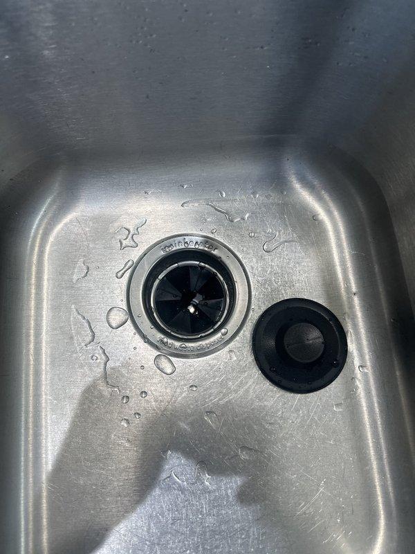 Responded to service call for non-functional garbage disposal replacement. Removed existing failed disposal unit and installed new garbage disposal with proper mounting assembly, electrical connections, and drainage configuration. Verified all plumbing connections for proper seal, tested unit operation, and confirmed disposal functions correctly with no leaks detected.
