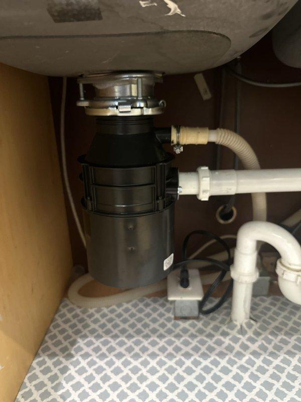 Responded to service call for non-functional garbage disposal replacement. Removed existing failed disposal unit and installed new garbage disposal with proper mounting assembly, electrical connections, and drainage configuration. Verified all plumbing connections for proper seal, tested unit operation, and confirmed disposal functions correctly with no leaks detected.
