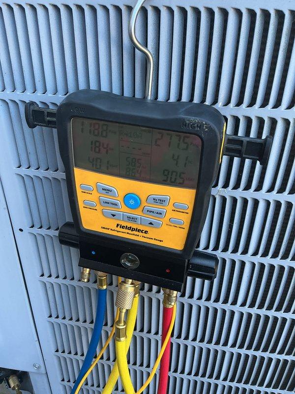 Completed basic monthly maintenance on two-system cooling heat pump installation. Performed diagnostic testing using digital manifold gauges to measure refrigerant pressures and temperatures on outdoor condenser unit. Verified superheat and subcool readings were within manufacturer specifications. Inspected Carrier air handler and indoor components for proper operation. System operating normally with all parameters in acceptable range. Customer advised that 20x20x4 filter replacement not included in basic maintenance service.
