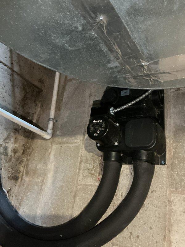 Completed annual basic cooling maintenance visit on residential HVAC system. Performed standard inspection of cooling equipment including condensate pump assembly with dual drain lines mounted in basement mechanical room. Verified proper operation of condensate removal system and checked all connections for secure mounting. Inspected ductwork system with green insulated plenum, noting normal dust accumulation on exposed surfaces. Replaced 16x25x4 air filter at return air housing, documented filter size and installation direction per airflow arrow marking. All cooling system components found operating within normal parameters. System ready for continued service under active maintenance agreement.