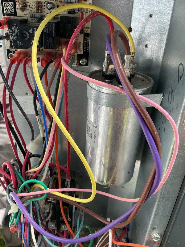 Diagnosed failed capacitor on outdoor condensing unit and performed replacement. Disconnected electrical connections from defective capacitor, installed new dual run capacitor, and reconnected all wiring to proper terminals. System tested and verified operational; will require follow-up visit to install standard turbo component.