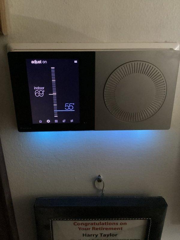 Responded to customer concern regarding AC unit continuously running and inability to reach setpoint below 69°F. Upon arrival, inspected Daikin heat pump system and reviewed operational parameters via system control interface. System diagnostics showed compressor operating at 100% cool demand with 16,881 hours runtime, indoor airflow at 1,320 CFM (81% fan demand), and outdoor fan running at 948 RPM. Thermostat confirmed indoor temperature holding at 69°F despite setpoint adjustment to 55°F. Verified system is maintaining previously achieved 68°F setpoint overnight as reported. System operating within normal parameters with no mechanical faults detected; unit running continuously due to extreme temperature differential between current indoor temp and unusually low setpoint request, which exceeds typical system capacity under current load conditions.