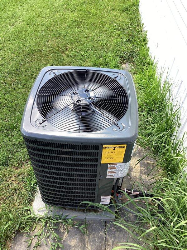 Responded to warranty callback for Goodman condensing unit vibrating off concrete pad following installation completed in May. Inspected unit positioning and pad placement, documented current condition with photos showing unit displacement and pad settling. Adjusted and repositioned unit on pad to restore proper placement and eliminate vibration issue.