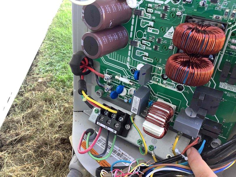 Responded to E6 error code on HVAC system. Diagnosed faulty inverter control board as the source of the fault code. Documented existing circuit board condition with photos showing PCB, capacitors, toroidal inductors, and heat sink assembly. Unit remains inoperable and unoccupied. Return visit scheduled to replace inverter board with spare unit from inventory to restore system operation.