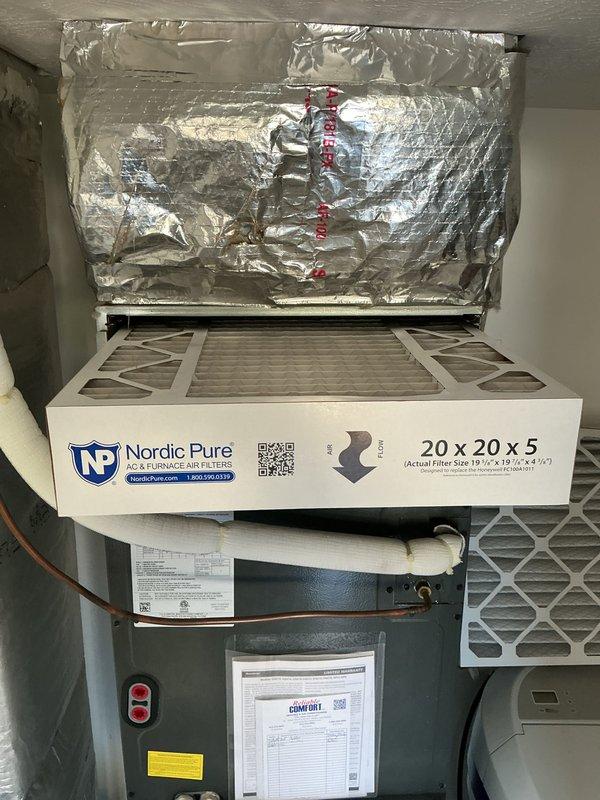 Completed cooling season tune-up maintenance on residential HVAC system. Performed standard inspection procedures including temperature differential measurements across the evaporator coil, recording supply air temperature of 54.95°F. Verified proper operation of air handler unit and inspected Nordic Pure 20x20x5 pleated air filtration system for adequate airflow and filter condition.