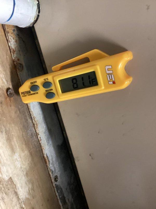 Responded to no cooling complaint on York HVAC unit. Upon arrival, performed diagnostic assessment including temperature readings on refrigerant lines using digital thermometer, which indicated 81°F suction line temperature. Inspected indoor air handler and noted visible water damage on wall above unit, suggesting potential condensate drainage issues or previous leak. Documented equipment conditions with photos for service records. Further diagnostic testing required to determine if compressor failure is confirmed or if system issues stem from other components such as refrigerant loss, electrical failure, or control board malfunction.