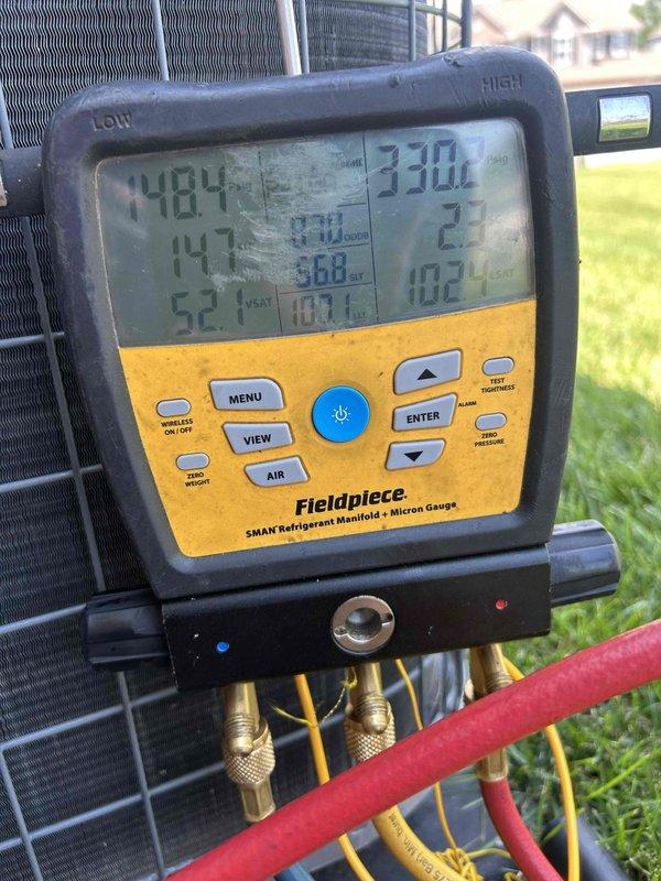 Responded to follow-up service call on residential air conditioning system previously suspected to be low on refrigerant charge. Connected Fieldpiece SMAN manifold gauges to outdoor condensing unit and performed diagnostic pressure and temperature readings to evaluate system charge levels and overall performance. Readings indicated system was indeed operating with insufficient refrigerant, confirmed by abnormal pressure differentials and temperature measurements. Located and repaired refrigerant leak, evacuated system, and recharged to manufacturer specifications, restoring proper cooling operation.