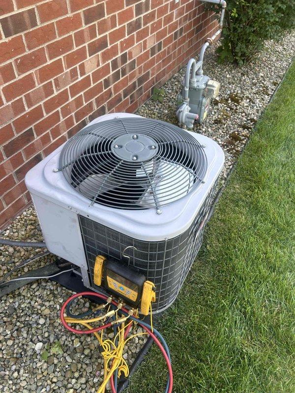 Responded to follow-up service call on residential air conditioning system previously suspected to be low on refrigerant charge. Connected Fieldpiece SMAN manifold gauges to outdoor condensing unit and performed diagnostic pressure and temperature readings to evaluate system charge levels and overall performance. Readings indicated system was indeed operating with insufficient refrigerant, confirmed by abnormal pressure differentials and temperature measurements. Located and repaired refrigerant leak, evacuated system, and recharged to manufacturer specifications, restoring proper cooling operation.