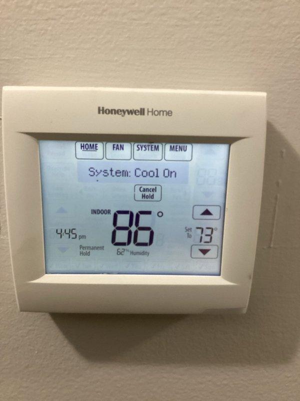 Responded to no cooling call and found complete loss of power to air handler unit. Diagnosed low voltage control issue with no power reaching the control board. Inspected thermostat showing system calling for cooling but unit non-responsive due to electrical fault at air handler. Identified failed control board preventing system operation and advised customer of warranty status for potential coverage of repairs.