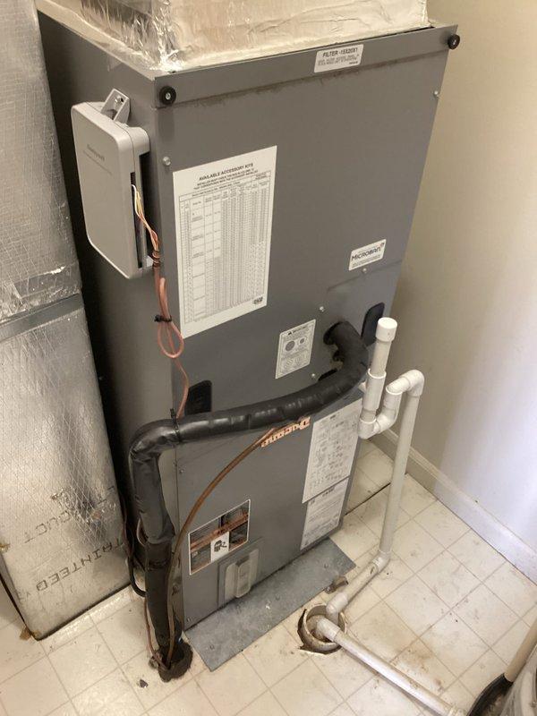 Responded to no cooling call and found complete loss of power to air handler unit. Diagnosed low voltage control issue with no power reaching the control board. Inspected thermostat showing system calling for cooling but unit non-responsive due to electrical fault at air handler. Identified failed control board preventing system operation and advised customer of warranty status for potential coverage of repairs.