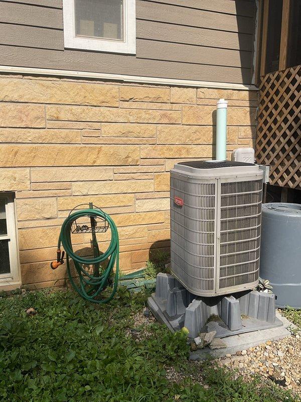 Provided estimate for relocating existing refrigerant line set from exterior AC condensing unit to indoor evaporator coil as part of customer's home renovation project. Assessed current line set configuration running along exterior wall and evaluated routing options through unfinished ceiling space with exposed joists, insulation, and existing HVAC ductwork to determine optimal path and material requirements for relocation.