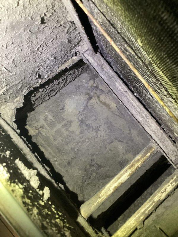 Responded to no-cooling call and performed diagnostic evaluation of residential HVAC system. Upon inspection, assessed furnace unit and air distribution components, including filter access area and ductwork connections. Documented system condition with photographic evidence showing existing equipment configuration, refrigerant line routing, condensate drain installation, and overall unit placement in mechanical closet. System evaluation completed to determine cause of complete unit failure reported by customer.