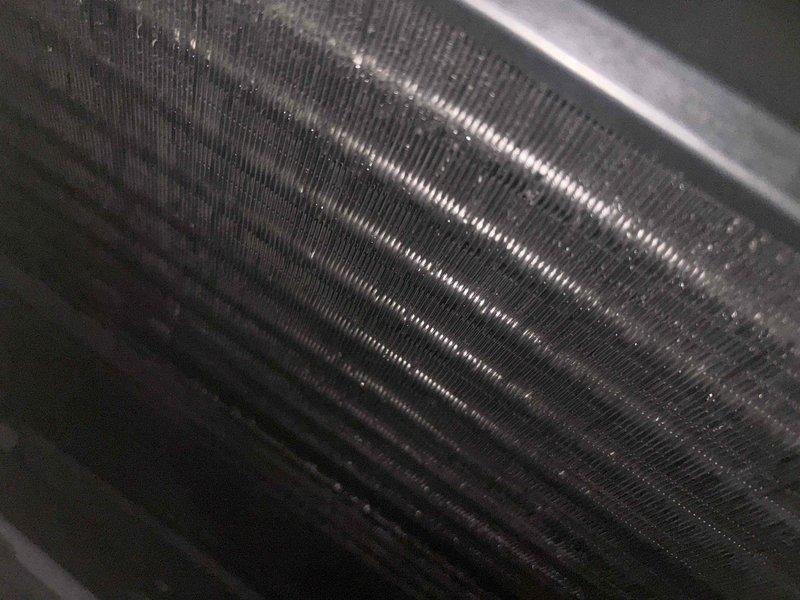 Completed preventive maintenance on two CCHP cooling systems, including inspection of evaporator coils and condensate drain lines. All components were found operational, with evaporator coils showing normal dust accumulation and PVC condensate drainage system functioning properly.