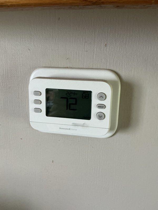 Completed annual basic cooling maintenance visit on residential CCHP system. Performed standard inspection and testing procedures on outdoor condensing unit and indoor components, verified thermostat operation showing 72°F setpoint on Honeywell FocusPRO digital control. System operating within normal parameters with no immediate service needs identified; 20x20x4 filter not included in this maintenance service.
