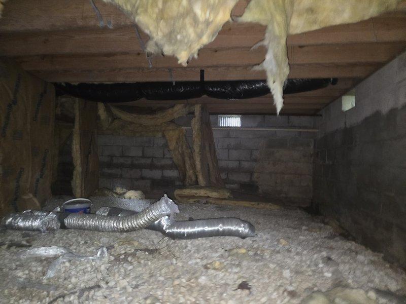 Responded to customer complaint of inadequate cooling and blower performance issues. Upon inspection, found evaporator coil heavily contaminated with dust and debris accumulation, significantly restricting airflow through the system. Cleaned evaporator coil thoroughly to restore proper air circulation. Inspected crawlspace ductwork and found flexible duct sections compressed and improperly positioned, further impeding system airflow. Repositioned and secured ductwork for optimal performance. System tested and verified proper operation with restored cooling capacity.