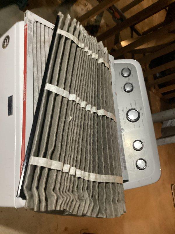 Responded to service call for air conditioning system that had stopped cooling with fan running continuously. Upon inspection, found thermostat displaying 82°F in OFF mode with fan set to AUTO, yet fan continued to operate. Examined evaporator coil assembly in attic space and found significant dust accumulation on aluminum fins, reducing heat transfer efficiency. Diagnosed issue as thermostat malfunction causing improper fan relay control and reduced cooling capacity due to restricted airflow across dirty coil. System restored to proper operation with thermostat controlling fan cycling correctly and cooling function operational.
