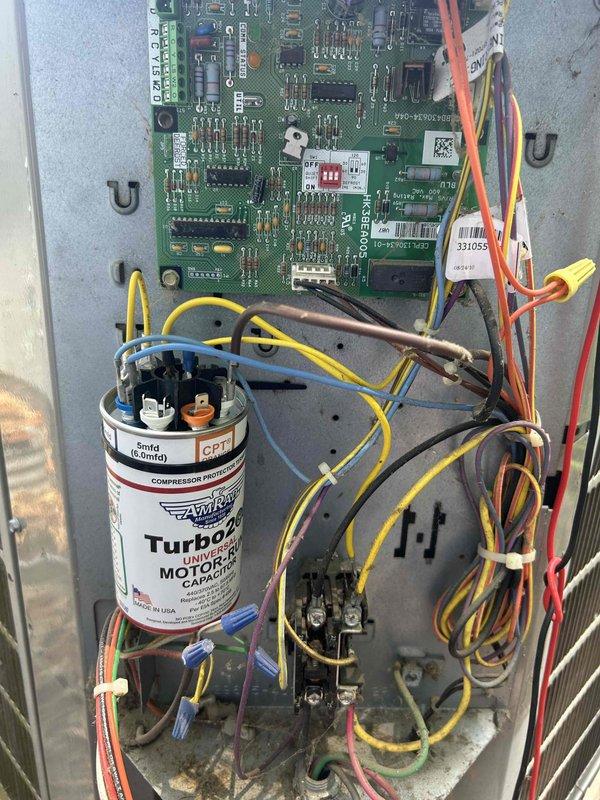 Responded to no cooling complaint on 10+ year old outdoor HVAC unit. Performed diagnostic testing of electrical system using digital multimeter to check capacitor and control board functionality. Tested Turbo 200 run capacitor for proper microfarad rating and identified failed capacitor as cause of compressor failure to start. Replaced defective run capacitor with new unit, verified all electrical connections, and confirmed system returned to normal cooling operation with compressor running properly.