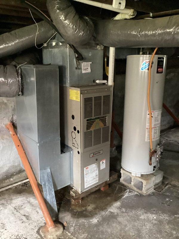 Responded to customer concern regarding inadequate cooling performance from air conditioning system. Performed comprehensive system inspection of HVAC equipment including thermostat operation, furnace/air handler unit, and associated ductwork. Verified thermostat was functioning properly and set to cooling mode at 70°F. Inspected indoor air handler unit and confirmed proper airflow through supply ducts. System components appeared to be in operational condition with no visible defects or immediate concerns noted during visual inspection.