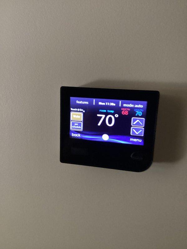 Completed basic monthly cooling maintenance on two HVAC systems. Performed standard inspections including temperature verification at thermostat showing 70°F set point in auto mode, and measured system performance parameters with digital multimeter reading 850 and analog pressure gauge indicating proper refrigerant levels within normal operating range. Both systems operating efficiently with no issues identified during routine service visit.