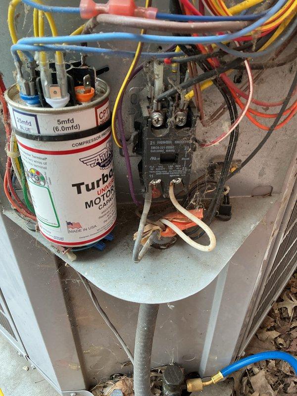 # HVAC Maintenance - Cooling System Service

Completed comprehensive monthly cooling maintenance on Carrier outdoor condensing unit. Performed standard inspection of electrical components including Turbo 200 capacitor (5mfd, 370V) and contactor assembly, verifying all wire connections and terminals were secure with proper color-coded wiring intact. Inspected refrigerant line connections at brass fittings and confirmed system integrity. Evaluated condenser cabinet condition, fan grille assembly, and airflow pathways through horizontal fin panels. Cleared debris and leaves from unit base and surrounding concrete pad to ensure unrestricted airflow and proper drainage. Verified disconnect box accessibility and overall unit operation. All electrical components functioning within normal parameters with no immediate service needs identified during this routine maintenance visit.
