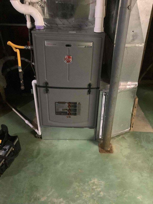 Responded to no-cooling call following power outage at residence with Rheem HVAC system and AprilAire thermostat. Upon arrival, found thermostat display completely blank with no power indication. Diagnosed loss of power to thermostat control circuit, traced issue to tripped breaker at main electrical panel caused by power surge during outage. Reset breaker and restored 24V control voltage to thermostat and system. Verified thermostat display powered on successfully, tested system operation through full cooling cycle, confirmed proper communication between thermostat and air handler, and verified normal compressor engagement. System restored to full operational status with all components functioning as designed.